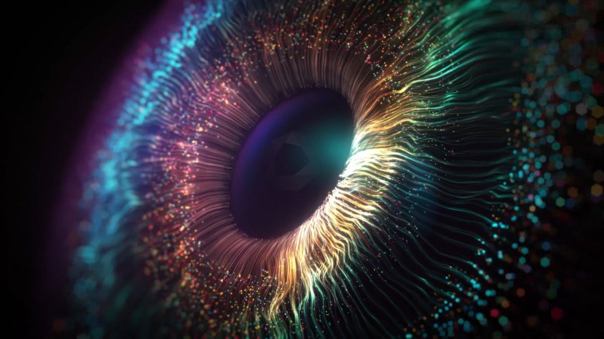 Abstract close-up of an eye made of glowing multicoloured particles