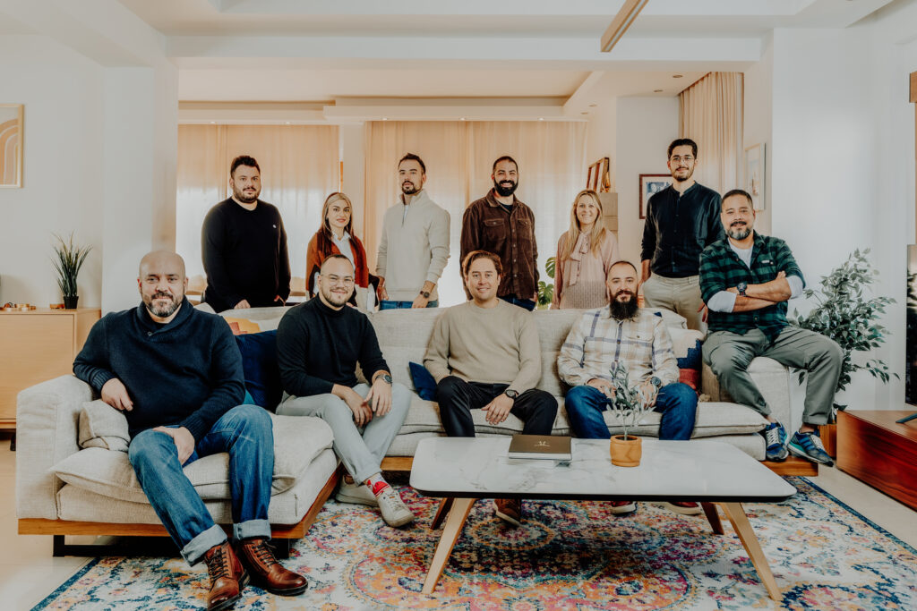 The Core Concepts team photographed together in a bright living room