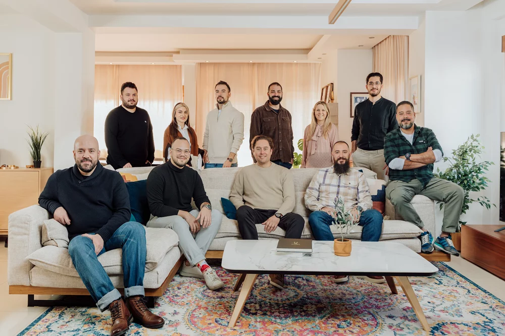 The Core Concepts team photographed together in a bright living room