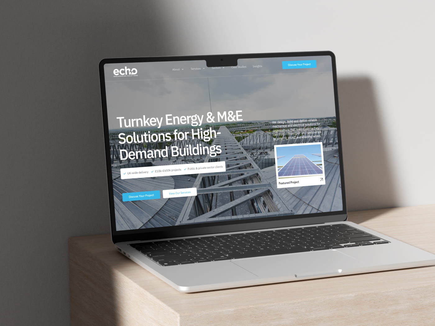 Core Concepts Design Echo website on a laptop, headed Turnkey Energy and M&E Solutions for High-Demand Buildings
